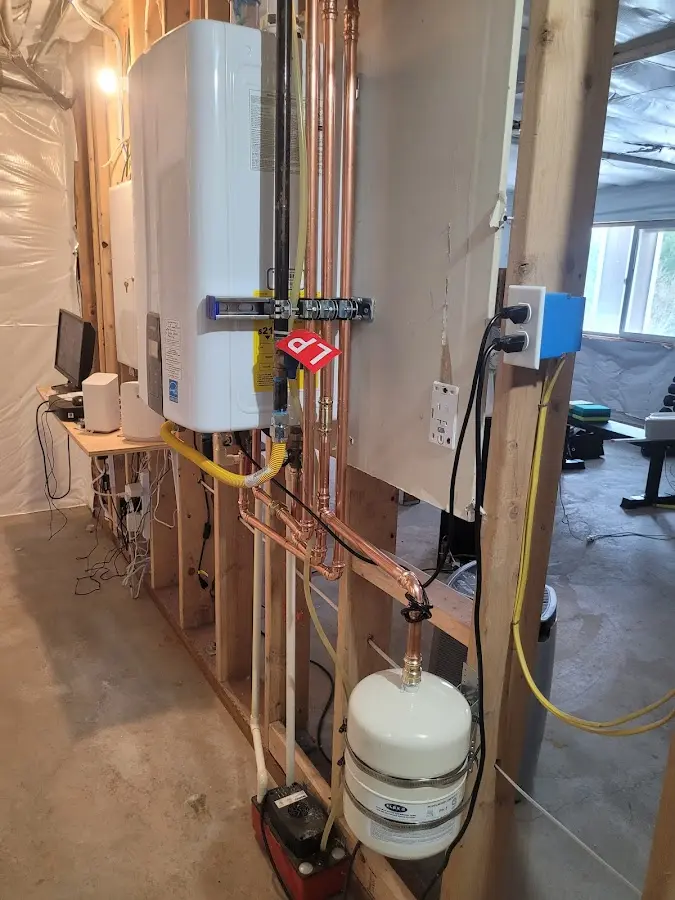 Licensed plumber repairing a kitchen sink in Syracuse